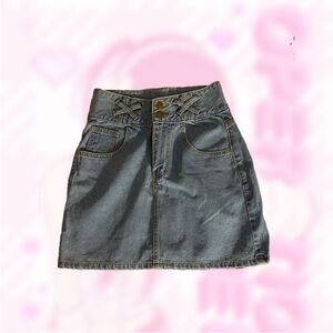 2000s navy and blue denim themed mini skirt with pocket/belt loop designs.